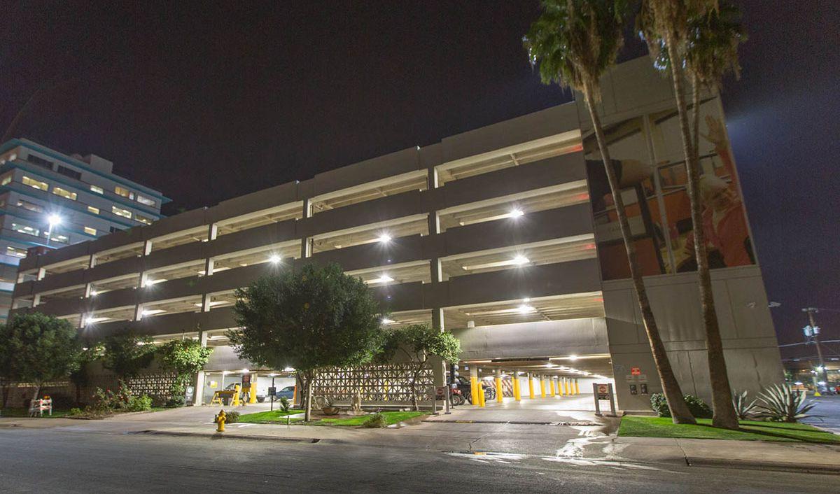 The U-Haul corporate office in Phoenix from the outside shown with bright parking garage lighting